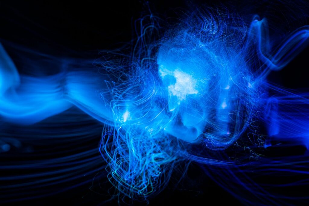Blue Light wave of energy explosion with elegant glowing lines. Abstract technology background.